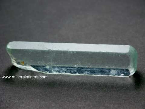 link to page displaying Facet Grade Gem Rough of <em>ALL</em> Minerals (gem-grade aquamarine crystal specimen shown)