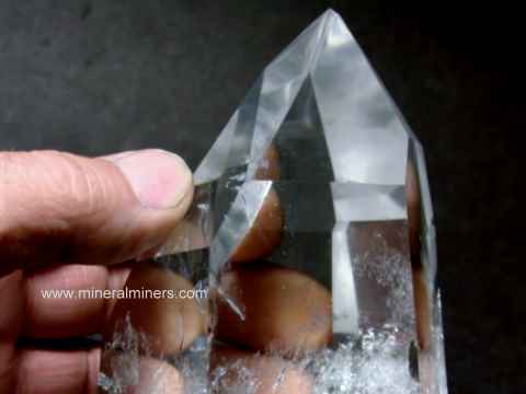 Quartz Crystals: polished clear crystals and milky crystals of natural rock crystal quartz